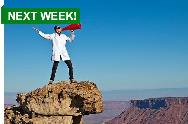 Scientist with bullhorn on mountain top
